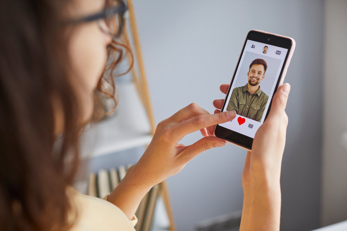 Young Woman Using Dating App on Mobile Phone